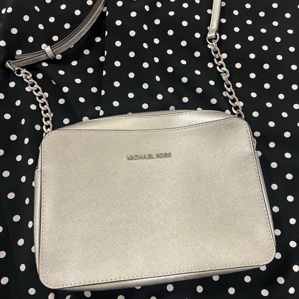 Brand new, never used, silver, Michael Kors cross body. Open to other offers :)